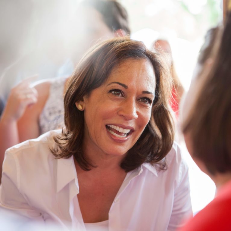 Kamala Harris speaking to a women in read