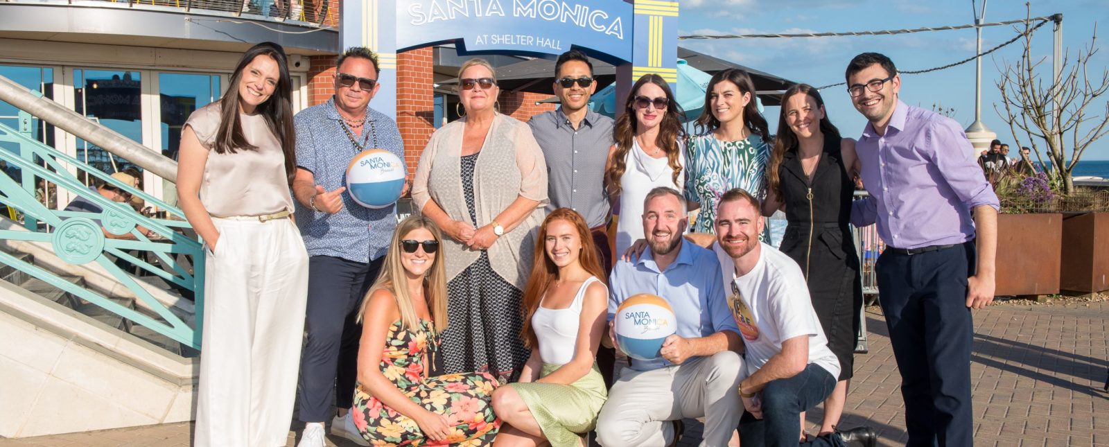 Team photo of the Hills Balfour team on Santa Monica Pier