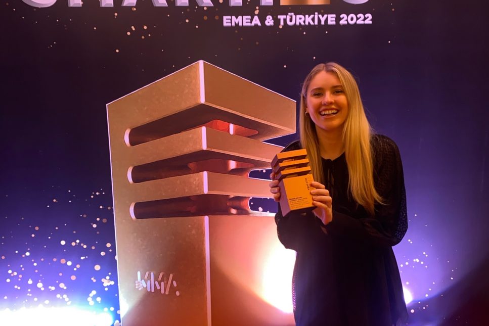 Emma Morgan, Senior Acount Manager, MMGY Hills Balfour collecting the bronze award for the Royal Welcome Campaign at the Smarties EMEA 2022 Woman on red carpet holding bronze award for Royal Welcome Campaign